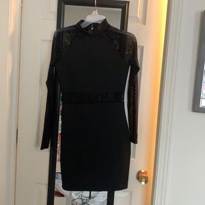 Little black dress with mesh cutout and sleeves